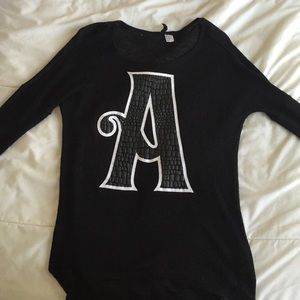 Black 3/4s sleeve top with faux leather "A"