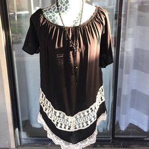 Long black blouse with white accented knit trim