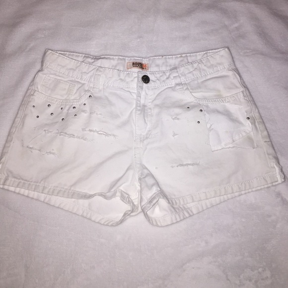 Torn up distressed white shorts