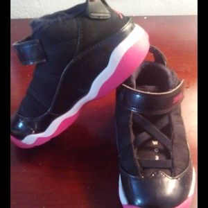 black pink and white Jordan's