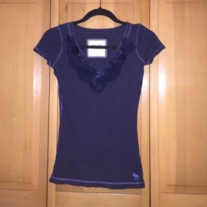 Navy Blue Vneck with floral fringe on chest