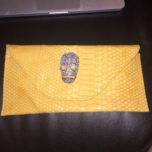 Yellow rhinestone skull clutch