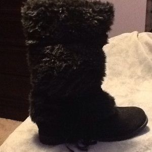 A black fuzzy boot