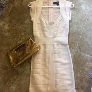 French connection dress with gold small clutch