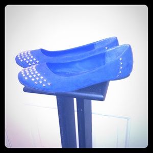 Royal blue suede studded flats.
