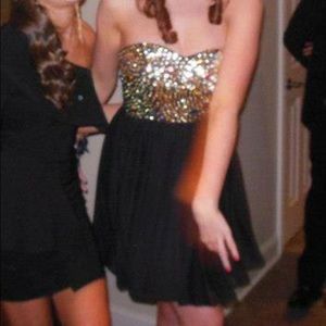 Black squin bejeweled formal dress.