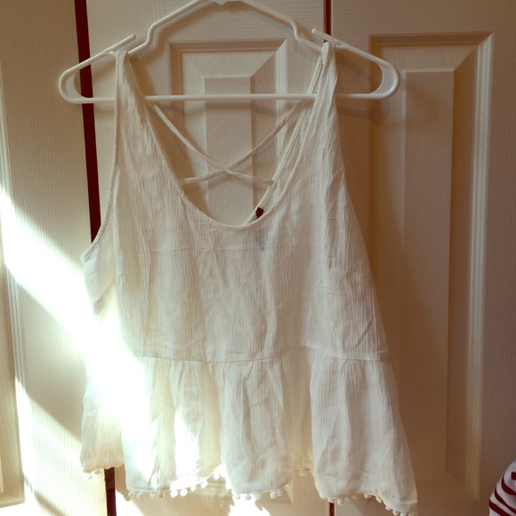 Never worn. Forever 21. White peplum top.