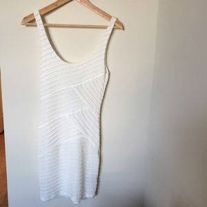 White body con dress with deep scoop back.