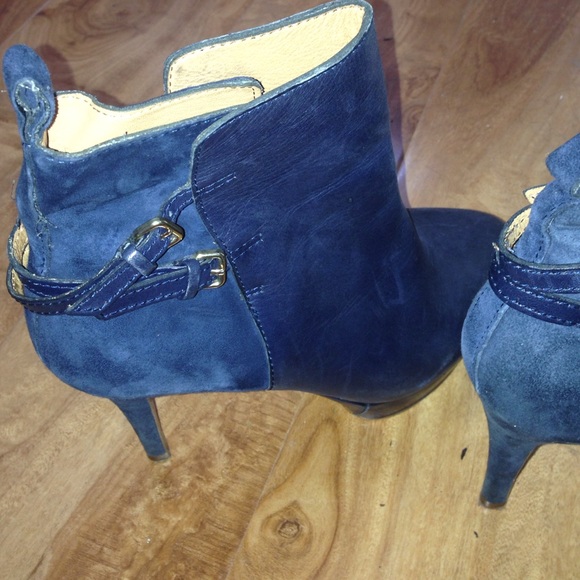 Navy booties with suede detail and gold buckles