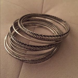 Set of 12 thin silver bangles