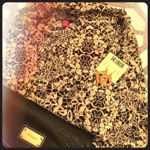 Flowy wrap style top. Black floral pattern 1X