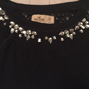 blue long sleeve hollister top with bejewled neck