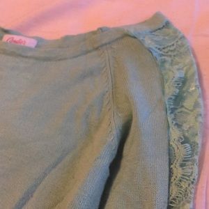blue sweater with lace down the arms