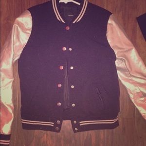 Varsity Jacket with gold sleeves.