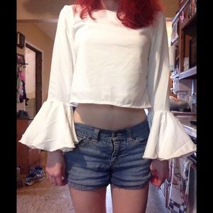 White crop top with ruffled sleeves and open back