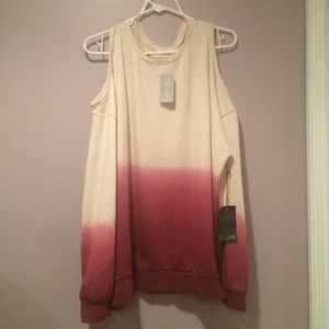 Long sleeve shirt. Shows off shoulders. Tan /wine