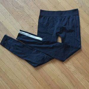 Black leggings with accent white and silver zipper