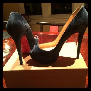 Christian Louboutin navy peep toe pump.