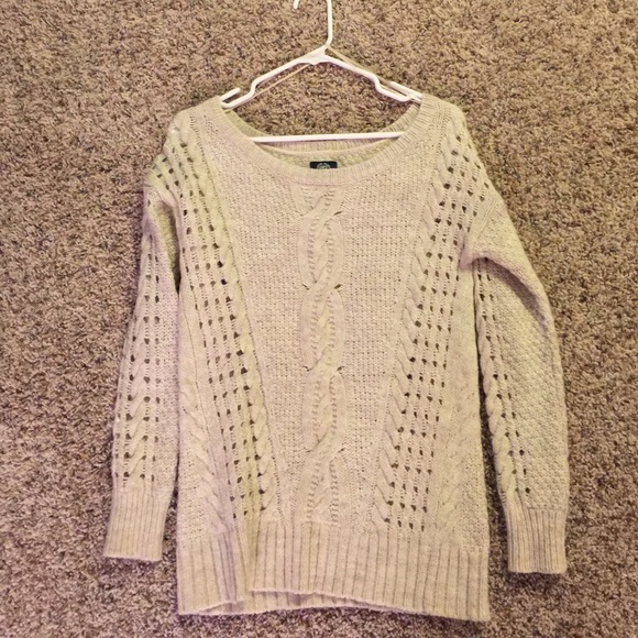 Cream colored fuzzy sweater.