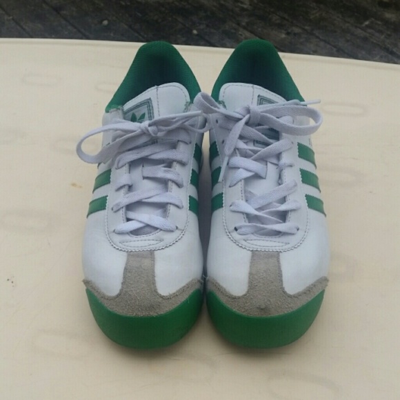Green and white Adidas somoa