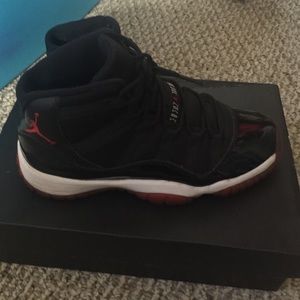 Jordan Bred 11s and Black Quilted purse