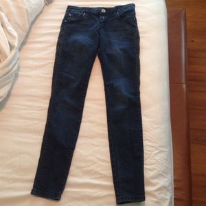 STS dark wash with black accent skinny jeans