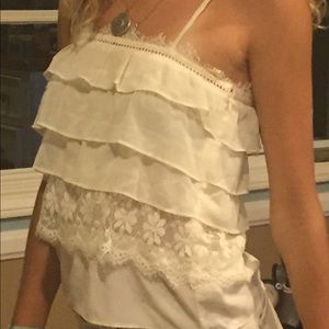 Brand new flowy layered spaghetti strap top.