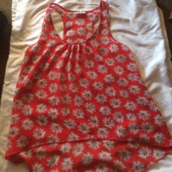 a red tang top w/ floral print.