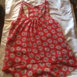 a red tang top w/ floral print.