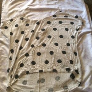 a white and black Polk a dot blouse.