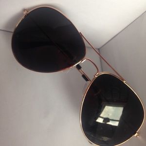 Black and gold aviator styled sunglasses