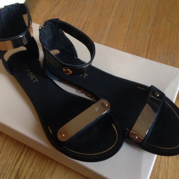 Report Black Sandles.