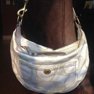 Coach white handbag with silver signature c's.