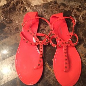 Jelly thong sandals with gold spike detail