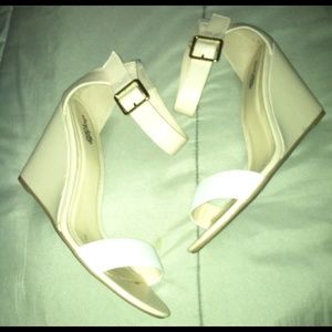 White and nude wedges.