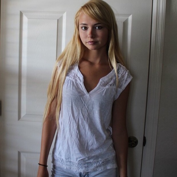 lace accented white v -neck