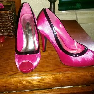 Deb Shop peep toe heels hot pink trimmed in black.