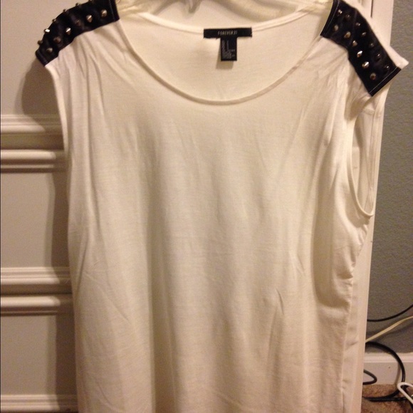 Cute white shirt with faux leather and studs