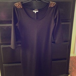 Dress with studded shoulder pads