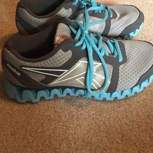Grey and blue reebok zigs