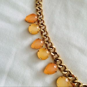 Gold chain with coral/orange tear drop beads