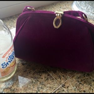 Cute snap top velvet hand bag.
