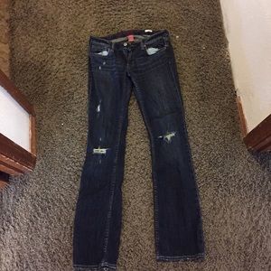 Distressed dark wash boot cut jeans