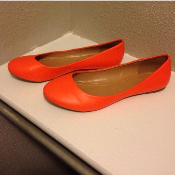 Bright orange flats