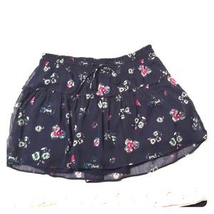 Navy blue skirt with floral pattern.
