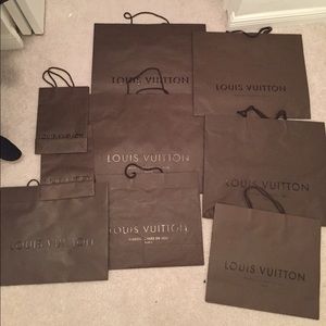 9 Louis Vuitton shopping bags