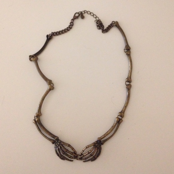 Skeleton hands necklace