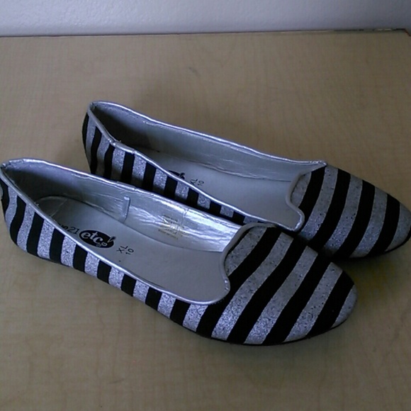 Silver and black flats