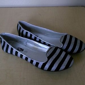 Silver and black flats
