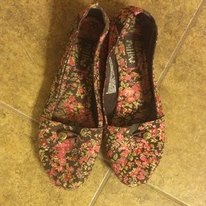 Brown/pink floral slip on shoes.